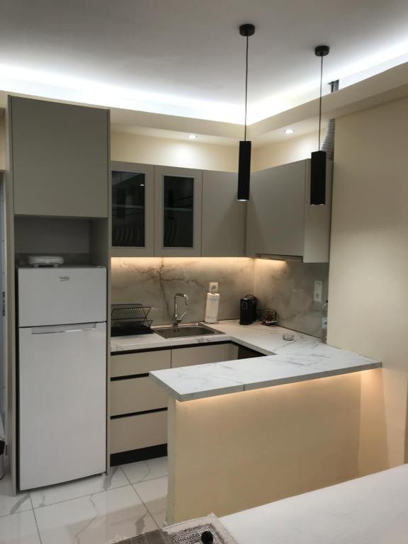 Modern kitchenette at Drenos Rooms